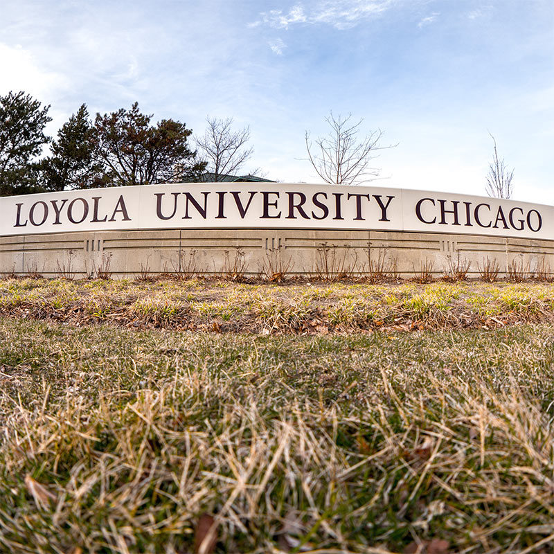 Low view of the Loyola University Chicago concrete sign