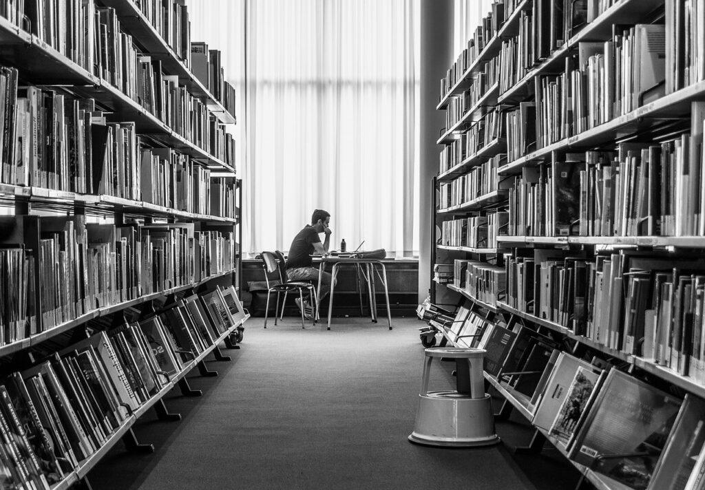 Young man studying in library