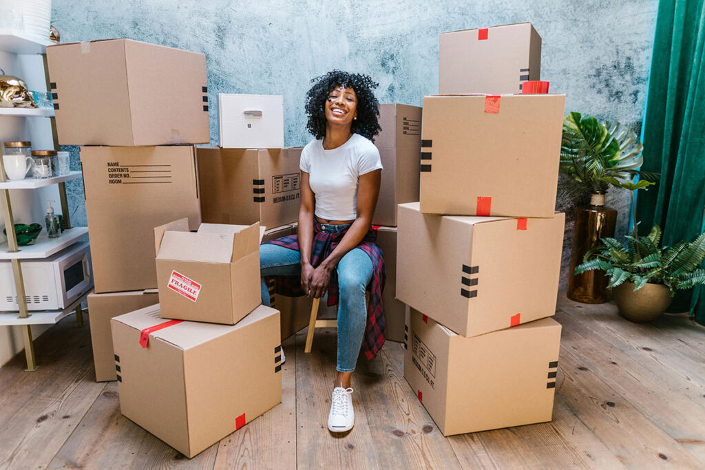 Smiling Woman with Moving Boxes