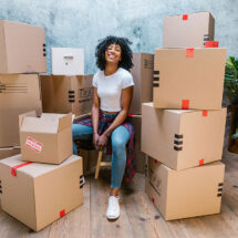 Smiling Woman with Moving Boxes